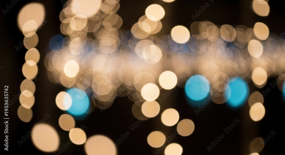 Obraz premium Blurry image of colorful string lights on a dark background with bokeh effect and copy space for des