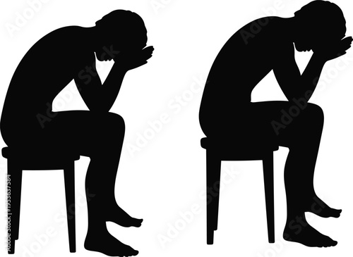 Silhouette of a depressed man sitting on a stool with head in hands, concept of sadness, loneliness, and mental health