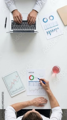 Wallpaper Mural Business meeting with charts and graphs on table, collaboration and analysis Torontodigital.ca