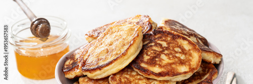 Wide banner with homemade pancakes and honey, cozy brunch breakfast food header