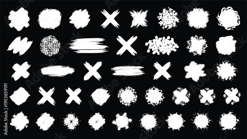 Extensive collection of various white paint brush strokes, splatters, and cross shapes on a solid black background for design elements.
