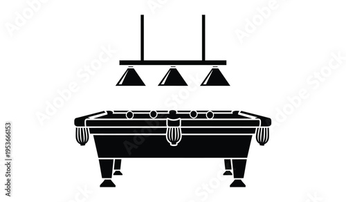 Silhouette of a pool table with a hanging light fixture above it in a game room setting