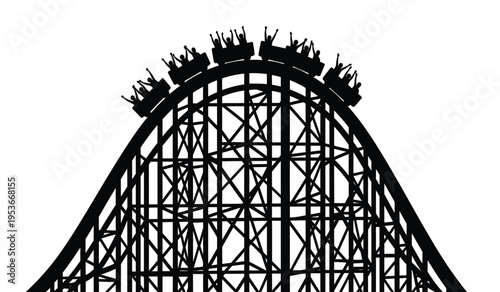 Silhouette of a roller coaster with riders cresting the top of a steep hill