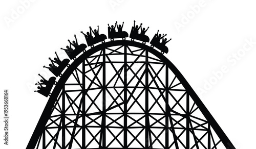 Silhouette of a roller coaster with riders cresting the top of a hill