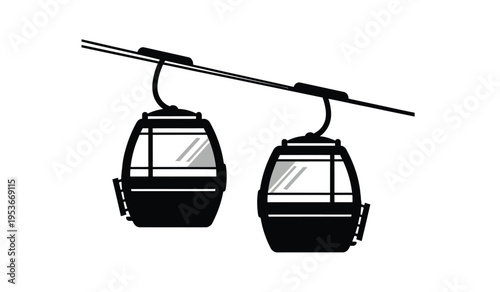 Silhouette of two cable car cabins suspended from a cable