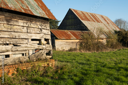 Weathered wooden barns on farm, Berkshire, England, UK