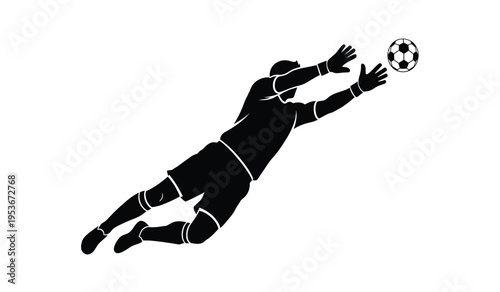Soccer goalkeeper in diving silhouette saving ball