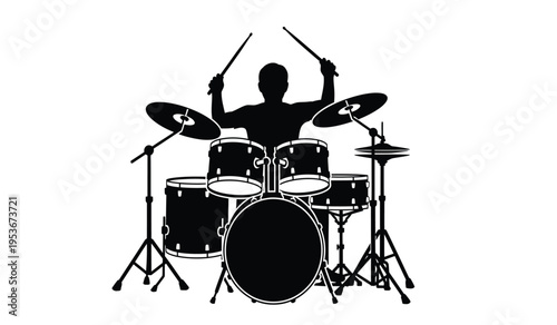 Silhouette of a drummer playing a drum set with silhouette