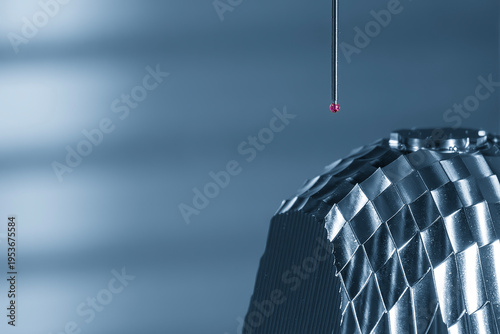 Close-up of a high-precision CMM probe measuring automotive components for quality control and dimensional inspection.