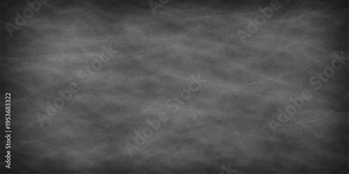 A blank chalkboard with a textured surface, evoking the spirit of education, communication, and learning, in a simple yet profound composition.