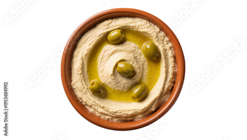 Tableau sur toile Creamy hummus with a swirl of golden olive oil and whole green olives, served in