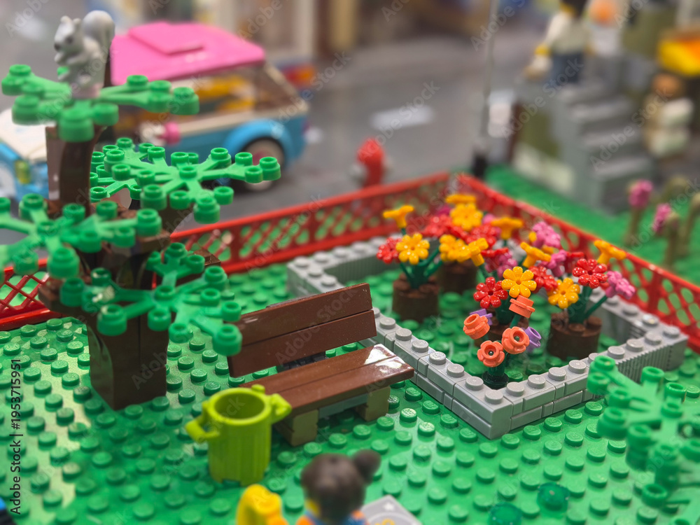 Obraz premium Lego miniature park with bench and colorful flower bed