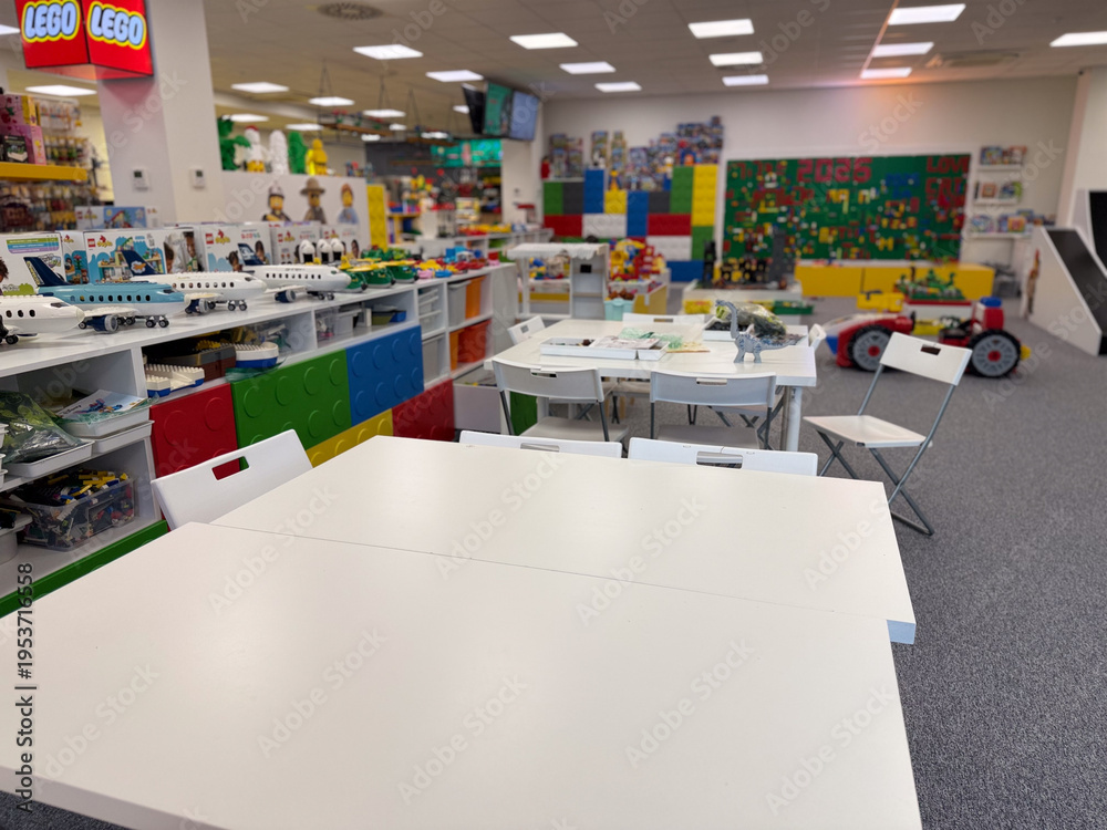 Naklejka premium Bright lego playroom with tables and displays