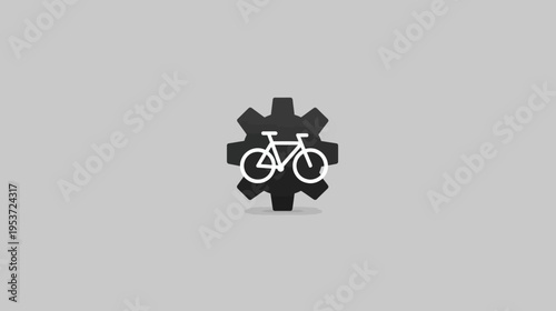 A white bicycle icon within a black gear on a gray background, suggesting transportation