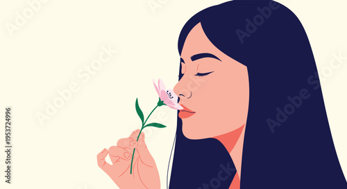 A beautiful woman with long dark hair smelling a delicate pink flower with her eyes closed, conveying a sense of peace and calm.