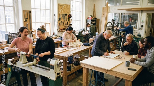 Crafting Community: Inside a bustling workshop, a diverse group of individuals share moments of joy and focused activity, crafting woodworks and engaging in collaborative projects.