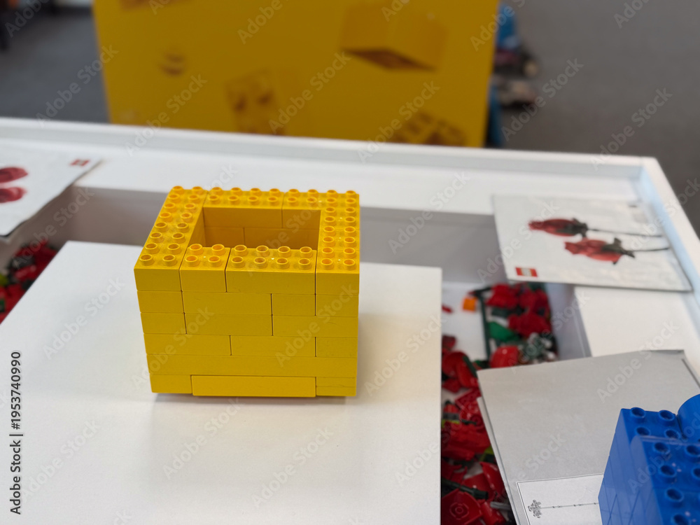 Fototapeta premium Yellow hollow lego cube on display