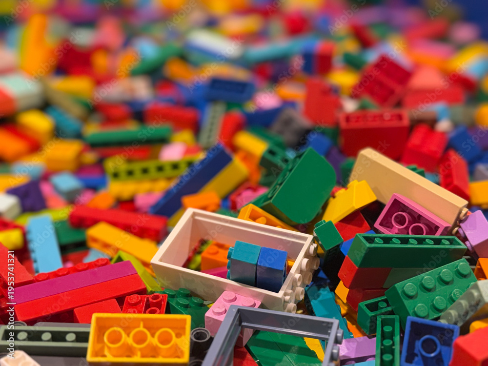 Fototapeta premium Colorful plastic building blocks pile