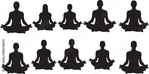 Silhouettes of people meditating in yoga poses together