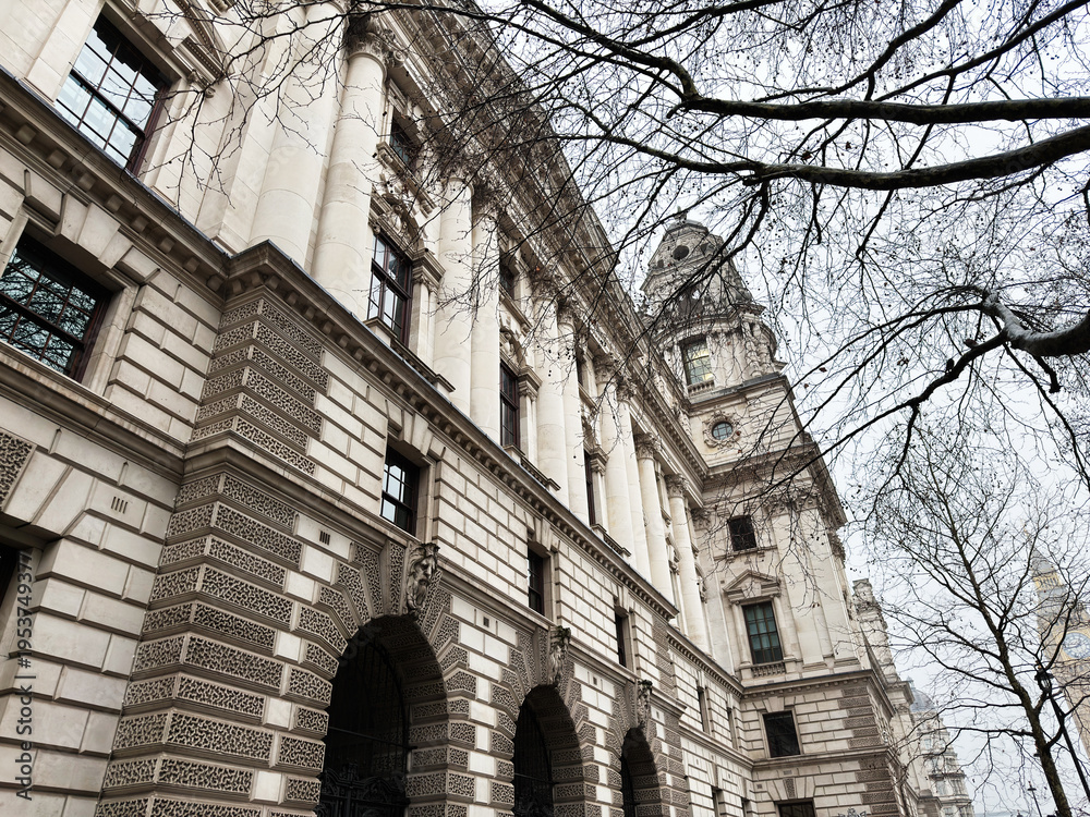 Fototapeta premium Historic neoclassical HM Treasury government building facade with columns and tower in London, UK