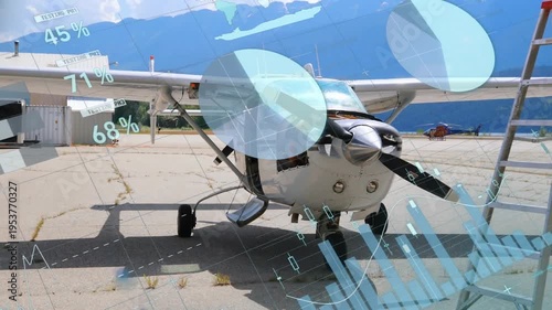 Animation of infographic interface over parked glider airplane in airport