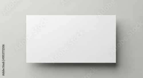 Wallpaper Mural Blank rectangular white paper or card casting a soft shadow on a neutral gray background, perfect for mockups and design templates Torontodigital.ca