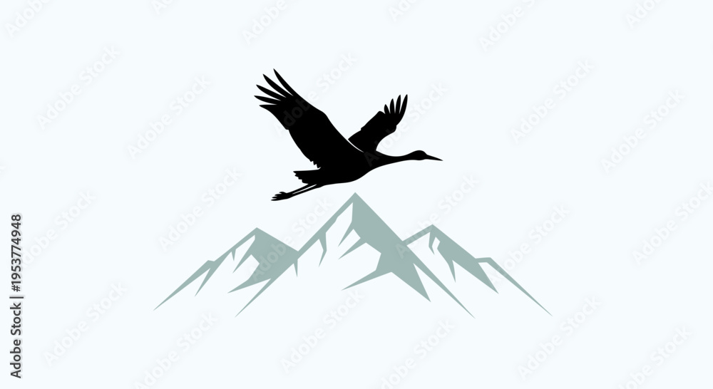 Fototapeta premium Silhouette of a majestic crane bird flying over snowcapped mountains.