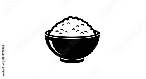 Black bowl filled with white rice.
