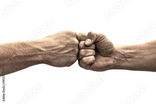 Teamwork, friendship, partnership. Bumping fists together. Fist Bump. Clash of two fists. Man giving fist bump