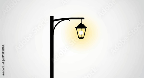 Black street lamp post with light.