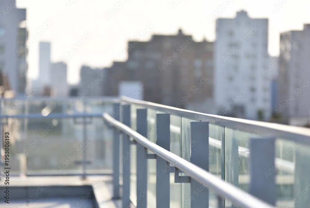 Fototapeta premium A balcony overlooks a city skyline. A person is standing on the balcony, looking out at the buildings. New York City.