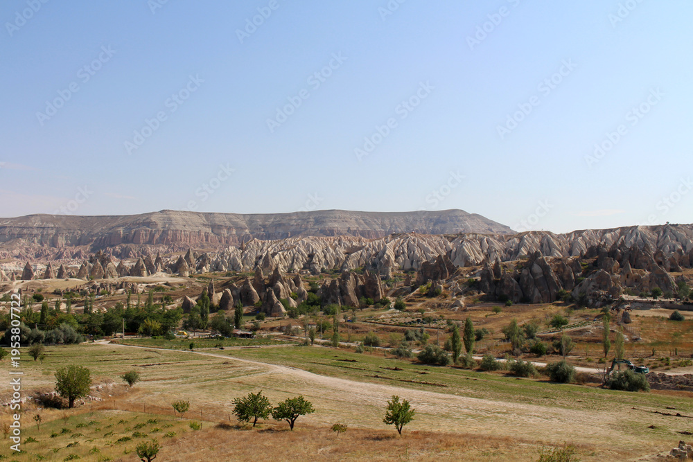 Fototapeta premium Arid landscape Rose Valley Goreme August 2024 Summer view of volcanic tuff formations