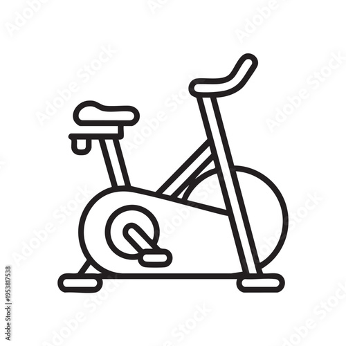 A sleek exercise bike is prominently displayed on a stationary bike trainer in a home gym environment from a side viewpoint.