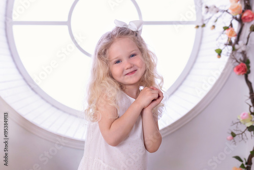Wallpaper Mural Closeup face of charming cheerful little girl looking in camera with gentle smile. Portrait smiling Beautiful cute adorable little girl with long blond curly hair. Happy childhood Torontodigital.ca