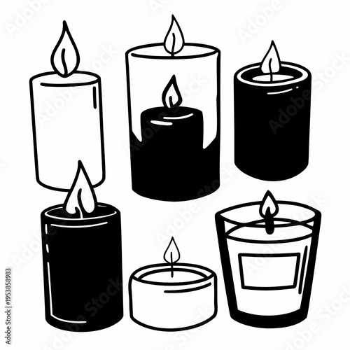 A group of lit candles in different shapes and sizes
