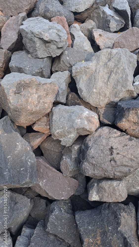 Fototapeta premium Pile of Natural Stones and Rocks for Construction Background