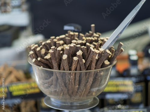 Licorice sticks, detail of fresh licorice sticks, craft sale in a market