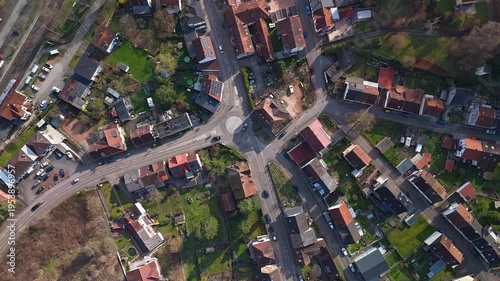 Aerial Timelapse of Busy Village Intersection with Cars and Train