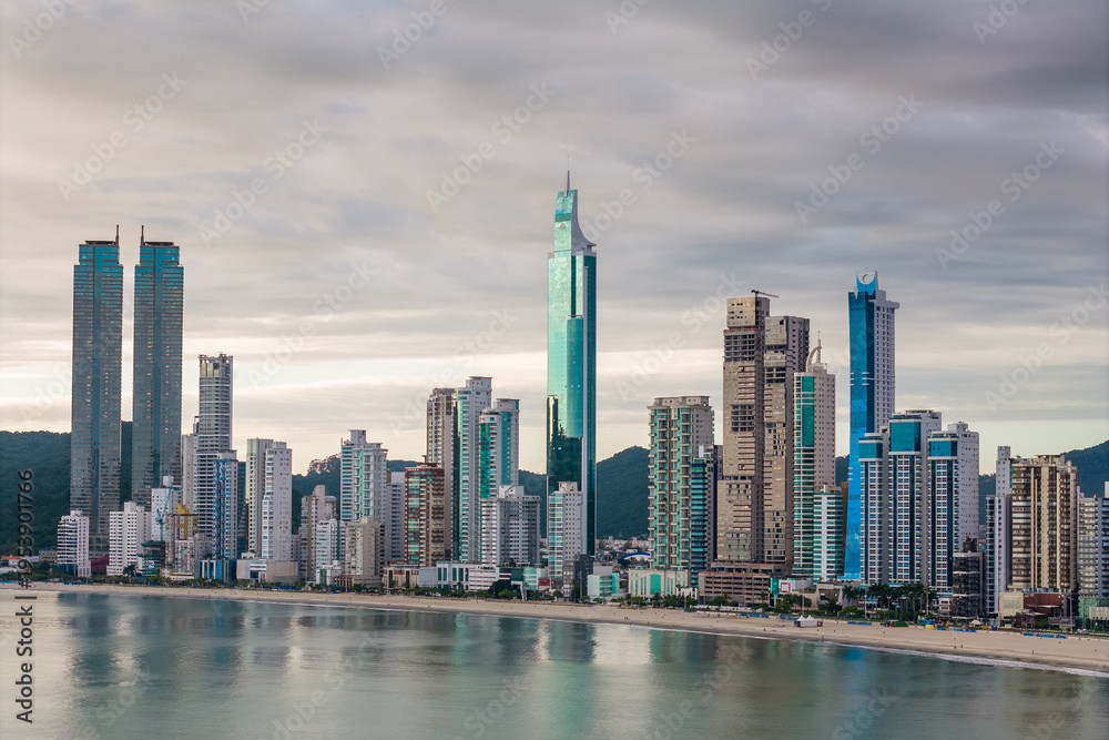 Fototapeta premium Skyline With High Rise Buildings in Front of the Beach With Dramatic Sky in Balneario Camboriu City in Brazil