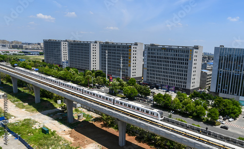 Canvas Print Wuhan Elevated Metro Train Line with Modern Residential Buildings