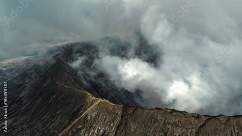 Foto Massive white plume rising from Mount Bromo crater, East Java, Indonesia