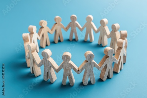 Unity in a Circle: A circle of wooden figures, hands clasped, stands as a visual metaphor for community, emphasizing connection, and the strength found in solidarity.