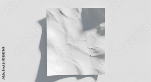 Crumpled white paper texture with soft shadow on minimal background