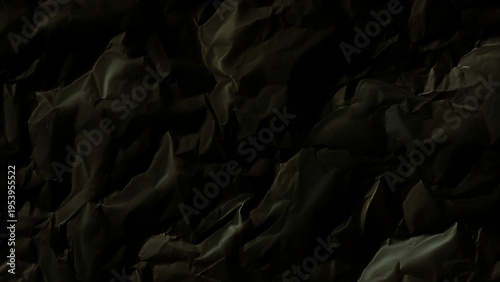 Crumpled black paper texture background with wrinkles and creases