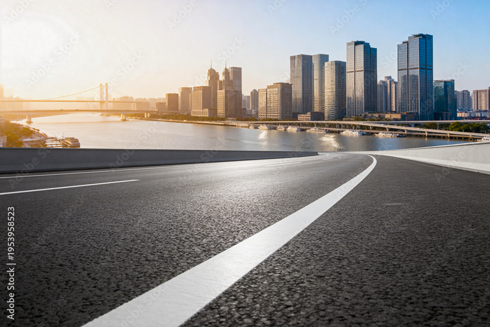 Fototapeta premium Asphalt Road Leading to Urban Skyscrapers and River