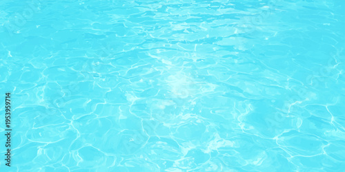 Blue water surface with bright sunlight reflections and ripples in swimming pool or tropical ocean