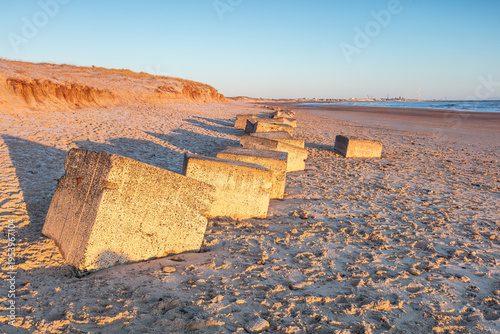 Bilde på lerret World War Two coastal defence concrete blocks and gun placement on Seaton Sluice Beach, Northumberland, England