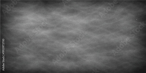 An Empty Classroom Blackboard with a dark, textured surface, ready for teaching or note-taking.