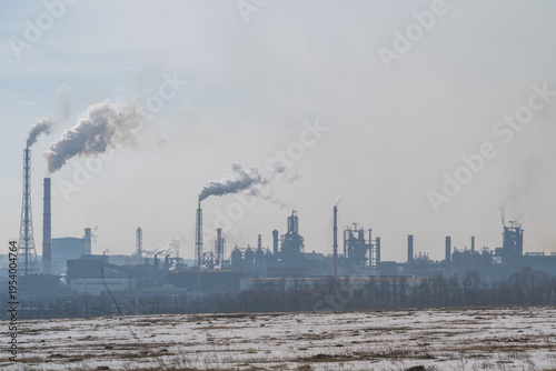 Obraz na plátně Factories belching smoke over fields