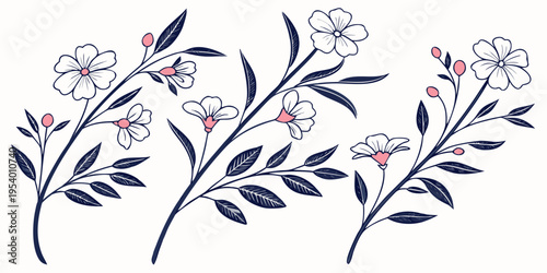 A delicate floral arrangement featuring pink and purple flowers with green leaves